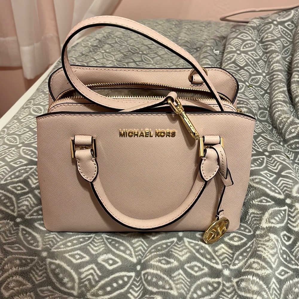 Michael kors pink cross body bag . I don’t wear it anymore .